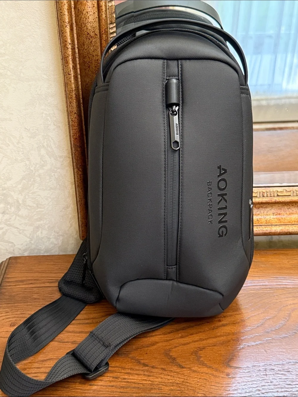 New without tag. Black Men’s Sling AOKING Backpack — Everyday Crossbody Carry.